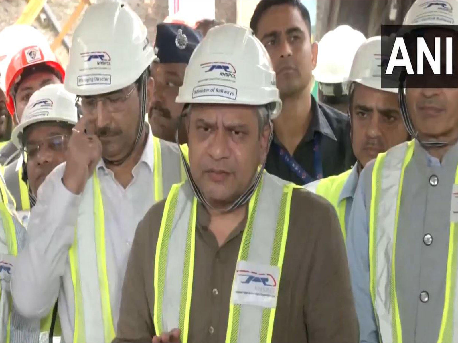 Railway Minister Ashwini Vaishnaw interacts with workers after Mumbai-Ahmedabad bullet train tunnel breakthrough
