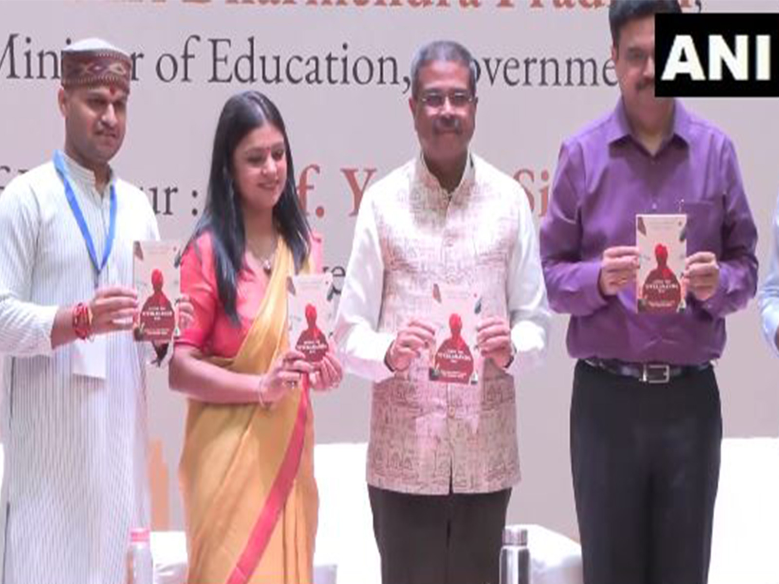 Union Education Minister Dharmendra Pradhan launching book with other dignitries (Photo/ANI) Union Education Minister Dharmendra Pradhan launching book with other dignitries (Photo/ANI)